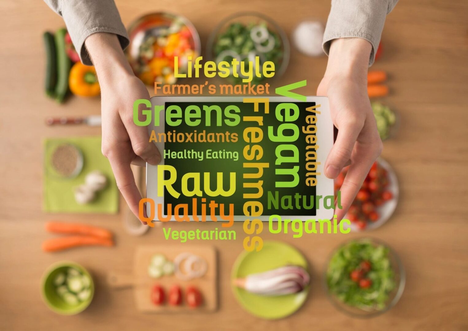 A person holding out their hands over a table full of food.