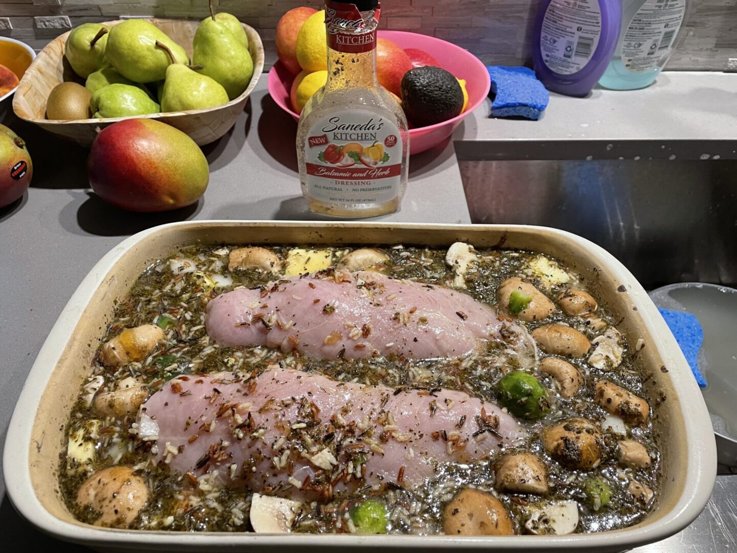 A pan of food with meat and vegetables on it.