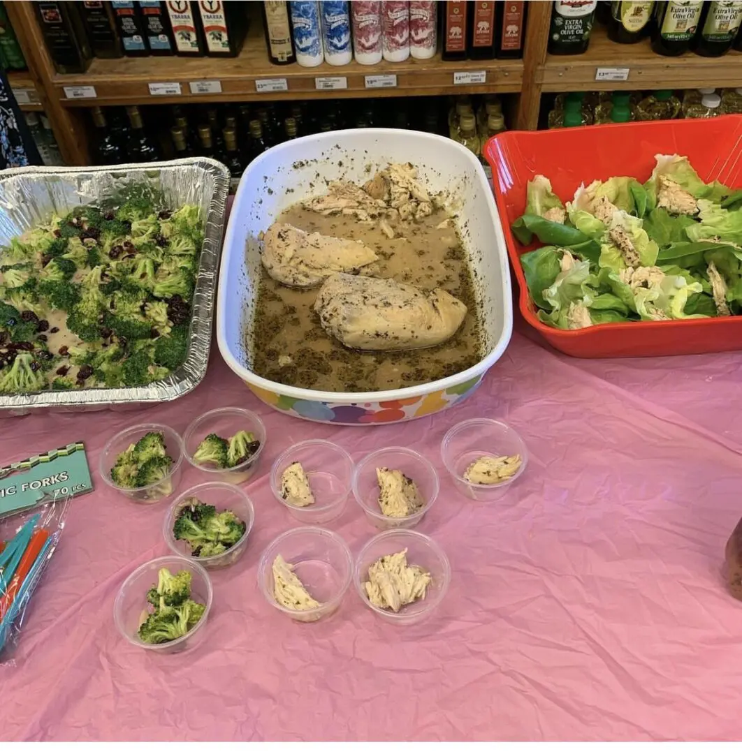 A table with several different dishes of food on it.